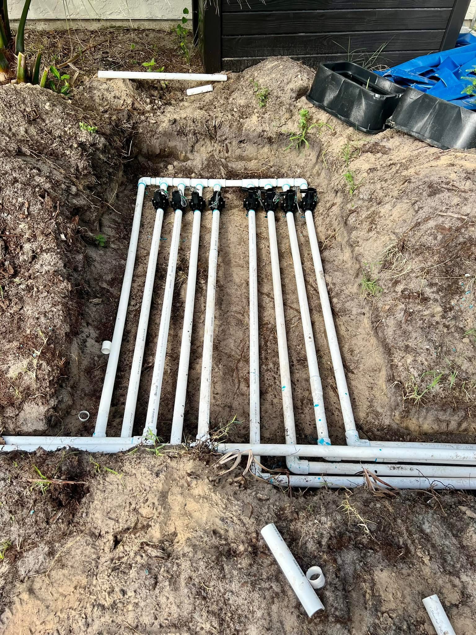 Irrigation valve manifold installation with multiple sprinkler zones and new PVC lines